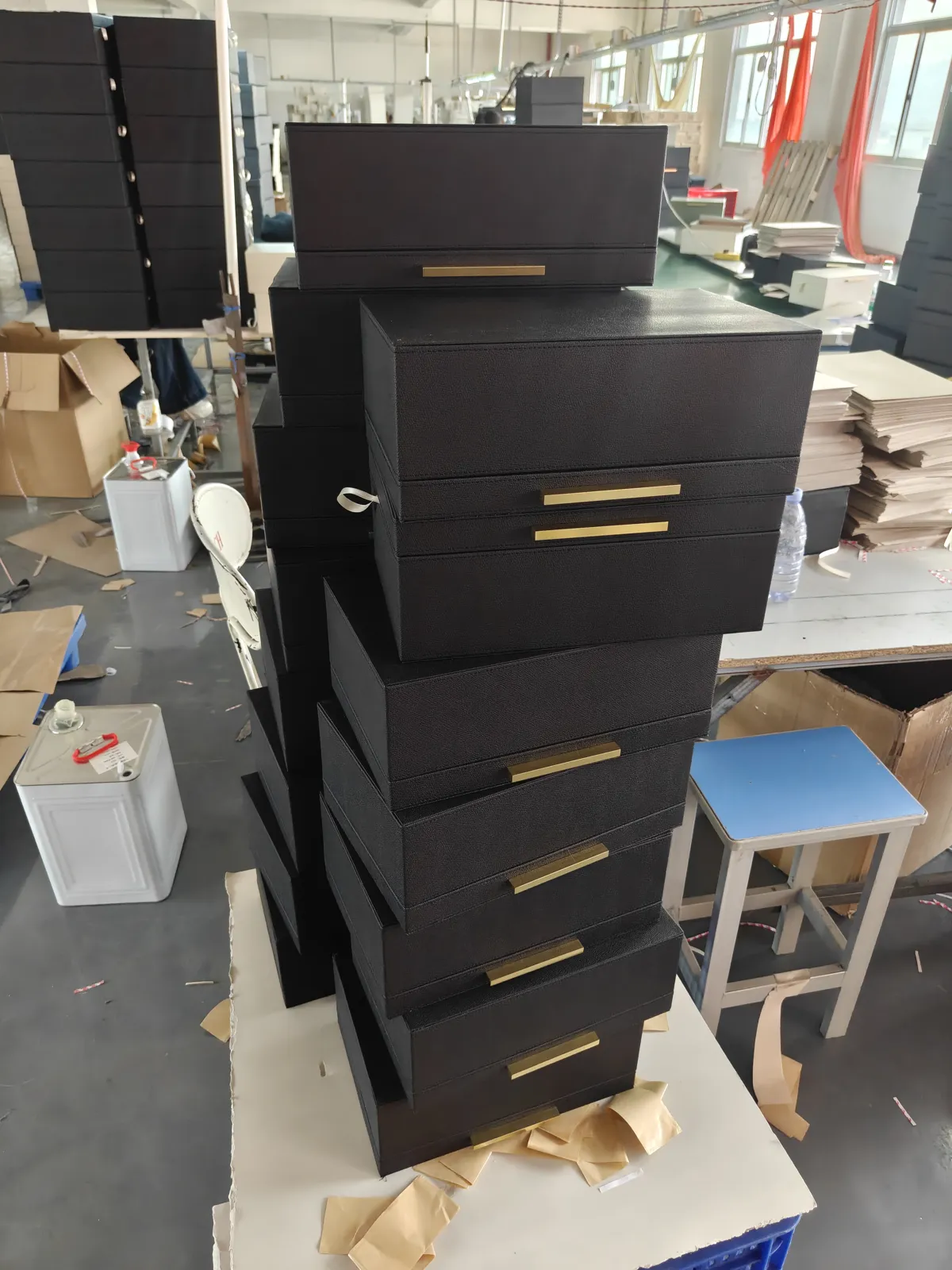 Black PU leather stackable jewelry boxes with brass handles in production